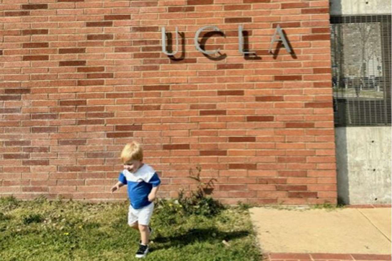 Levi Jonathan walks in the grass at UCLA. 