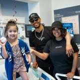 Los Angeles Dodgers all-star Mookie Betts and his wife, Brianna Betts, visit with Stella, a patient at Mattel Children's Hospital. 