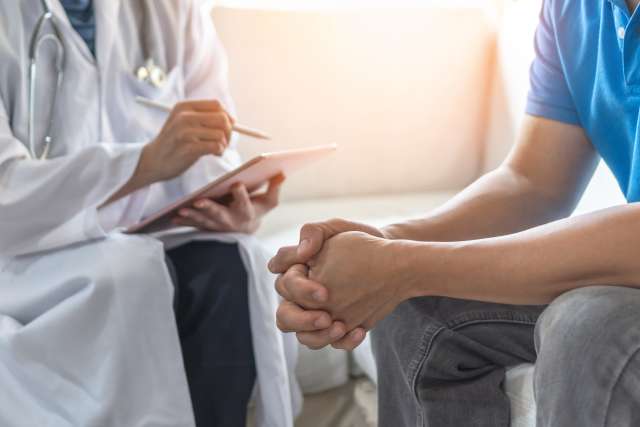 man with doctor at a doctor's appointment