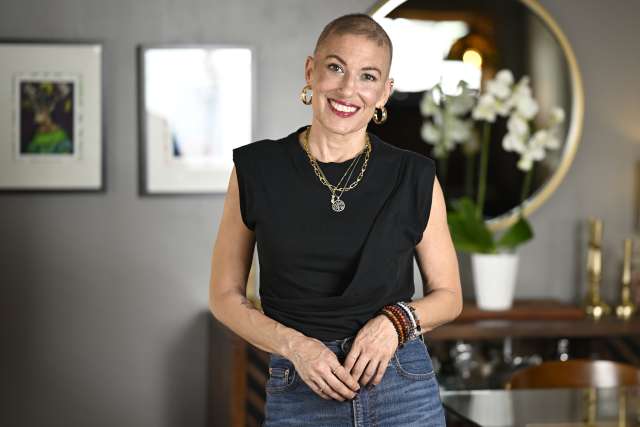 Ali Spuck smiles during a portrait session at her home