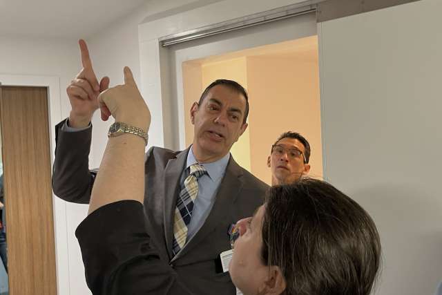 Chief Operating Officer Richard Azar and Suzanne Kiely, project manager with real estate, planning design and construction, discuss ceiling fixtures in a prototype patient room. Looking on is Dr. Erick Cheung, chief medical officer of the Stewart and Lynda Resnick Neuropsychiatric Hospital at UCLA. 