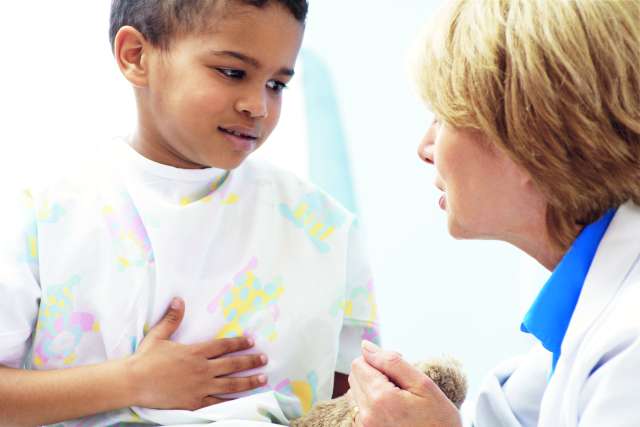 boy speaking to pediatrician