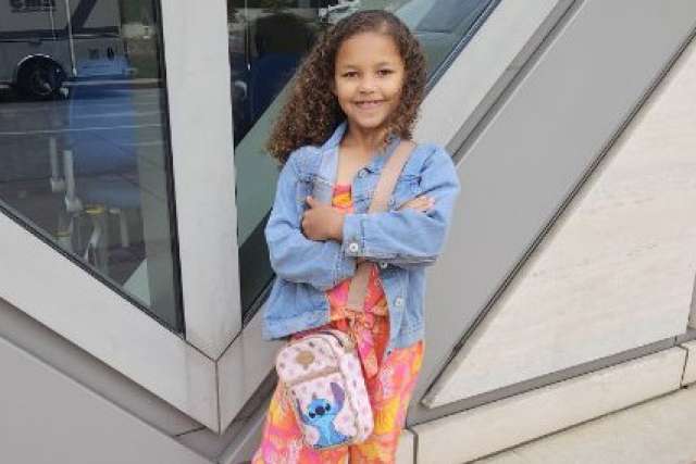 Keona Mock stands outside a building at UCLA Health