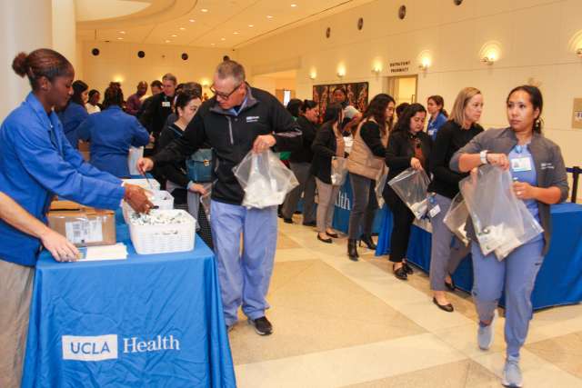 UCLA Health staff pack hygiene kits for use by Homeless Healthcare