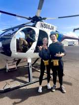 Joshua Hubert, DO, MS and his wife taking a helicopter in Hawaii 
