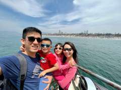 Yi Wei Tan, MB,BS, M.Med and her family at the Santa Monica Pier
