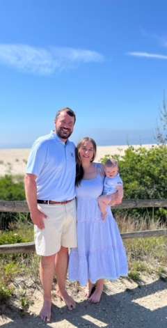 Kristina Michaud, DO, MS and her family by the beach