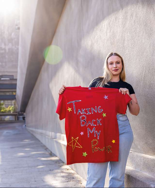 Julie Fordyce holding a shirt