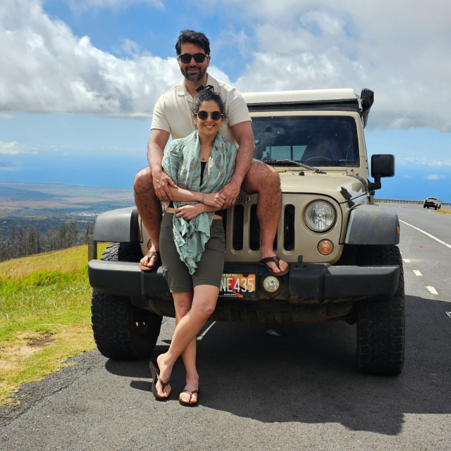 Jose Hernandez Carcamo and wife, Pamela, in Maui standing in front of jeep