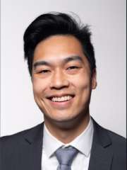 Headshot of Andy Lin in black suit